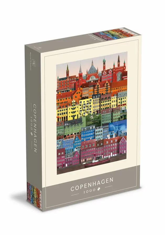 Photo of the 1000 piece Copenhagen jigsaw puzzle in rainbow colors in the box.