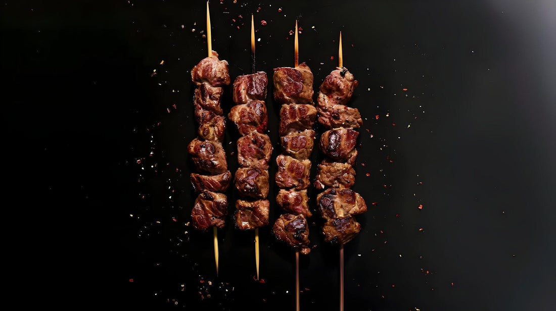 Meat on four skewers, ready to serve for an outdoor grill party