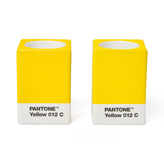 Two Copenhagen Design Pantone Yellow 012 candle holders without candles, showing the recessed candle openings