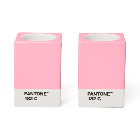 Two Copenhagen Design Pantone Light Pink 182 C candle holders without candles, showing the recessed candle openings