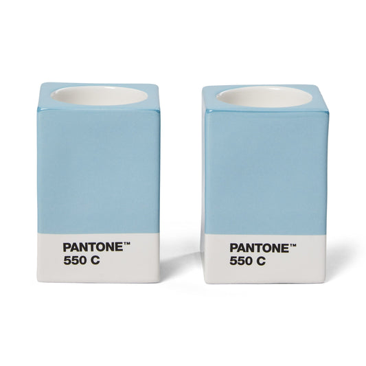 Two Copenhagen Design Pantone Light Blue 550 candle holders without candles, showing the recessed candle openings