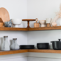 Shelves filled with modern kitchen products and decor